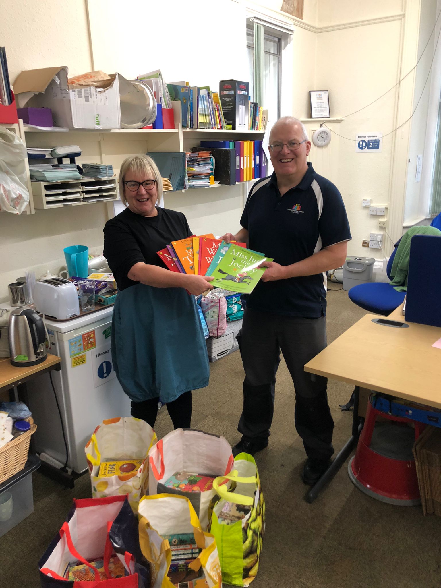 Hospice donates books to Literacy Volunteers 