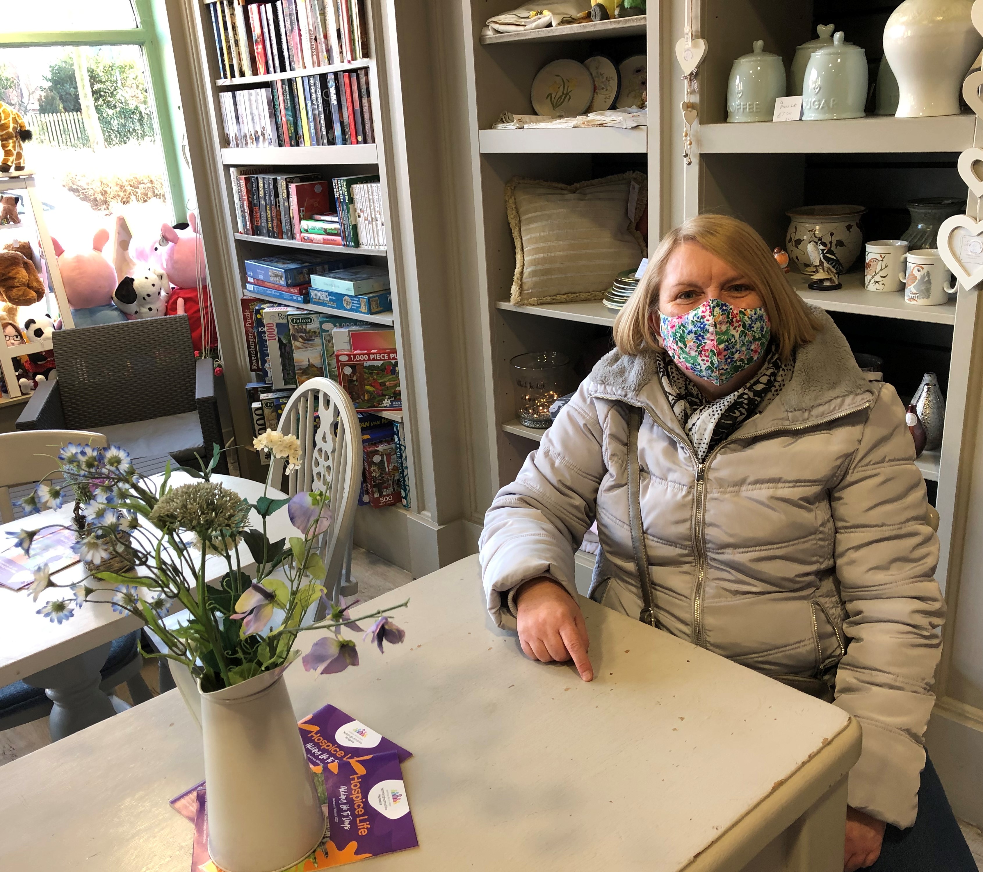 Customer at Nottinghamshire Hospice Blidworth shop waiting for coffee