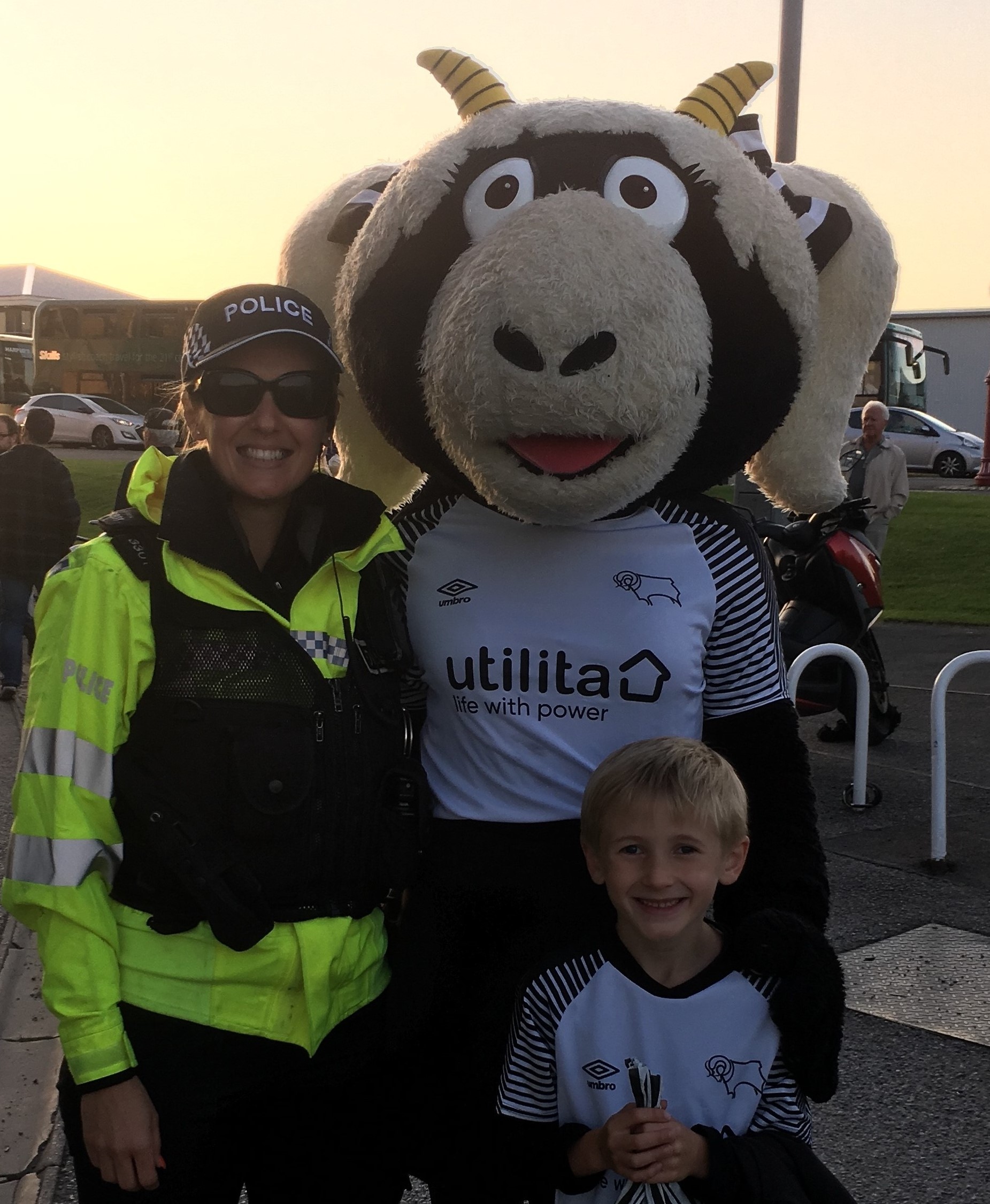 Sarah in Police uniform with her son