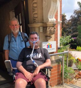 Sam with his father outside Nottinghamshire Hospice