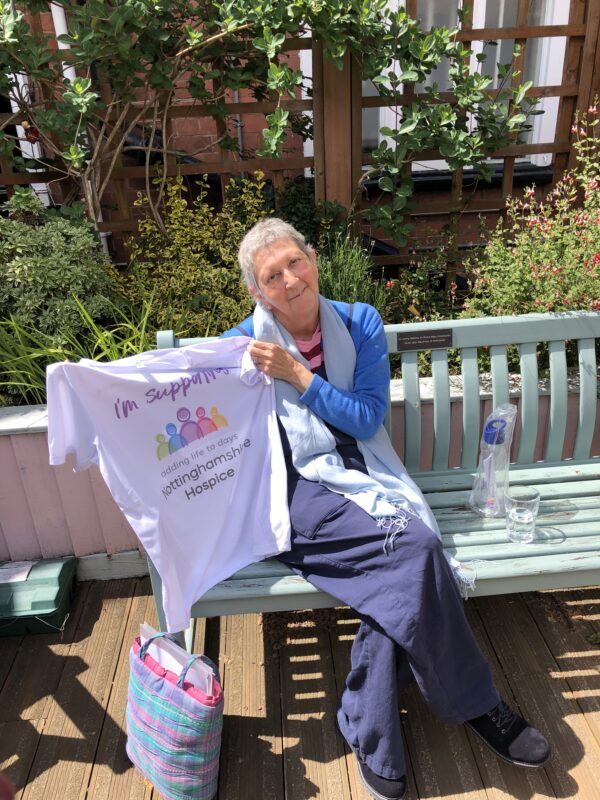 Hilary holding up Notts Hospice t-shirt