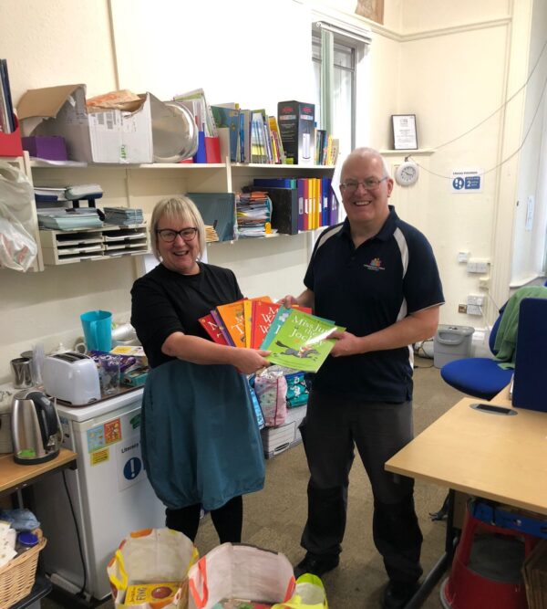 hospice driver delivering books to literacy volunteers