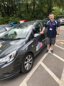 Marc Dewstowe with a Nottinghamshire Hospice car