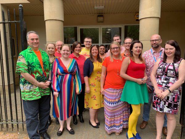 Staff of Cambridge and Counties Bank outside the bank