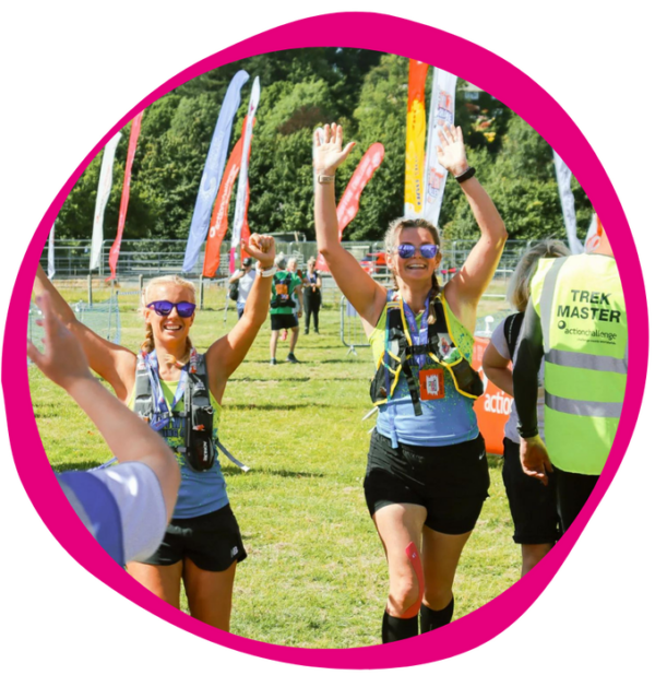 2 (two) women cheer finishing peak district ultra challenge marathon - branded colour border