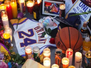 Memorial for Kobe Bryant at Staples Center, with flowers, candles, a jersey and photographs.